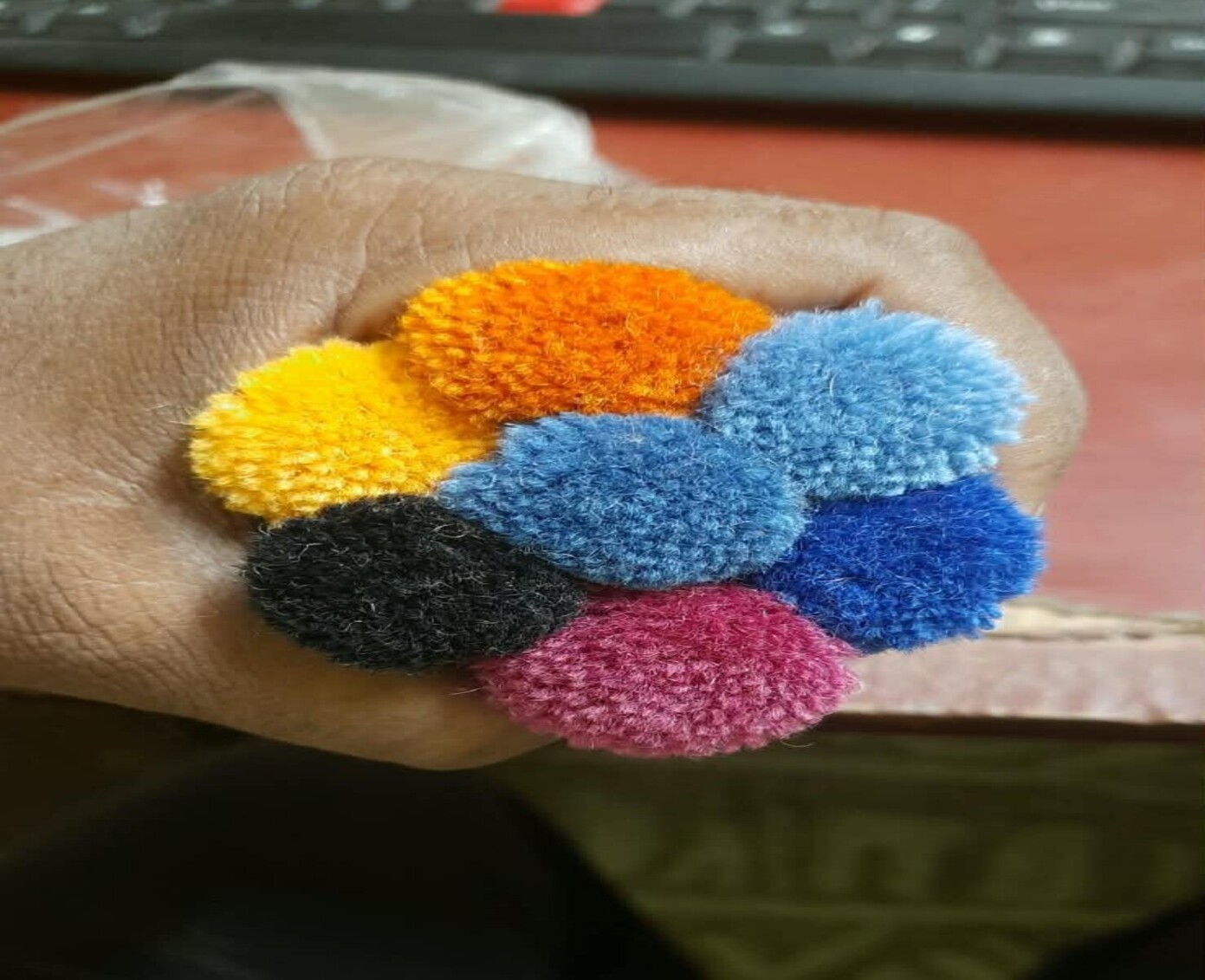 Original collage of dyed yarn, colour samples and yarn labels
